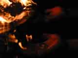 two hands holding flames