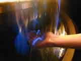 holding blue flames