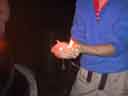 Bob holds flames -- closeup, small flames