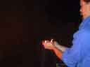 Bob holds flames -- side, small