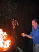 Kiki photographs Bob holding flames [takes]