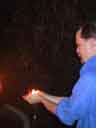 Bob holds flames -- side