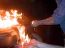 Two hands hold flames