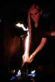 Kiki holding flames