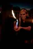 Kiki holding small flames